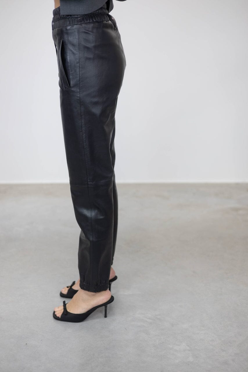 JUSTICE ELASTIC WAISTBAND LEATHER PANTS PANTS STAND STUDIO 