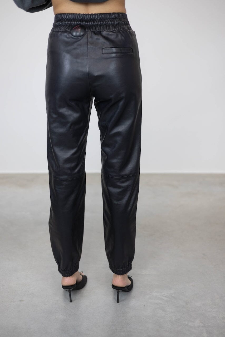 JUSTICE ELASTIC WAISTBAND LEATHER PANTS PANTS STAND STUDIO 