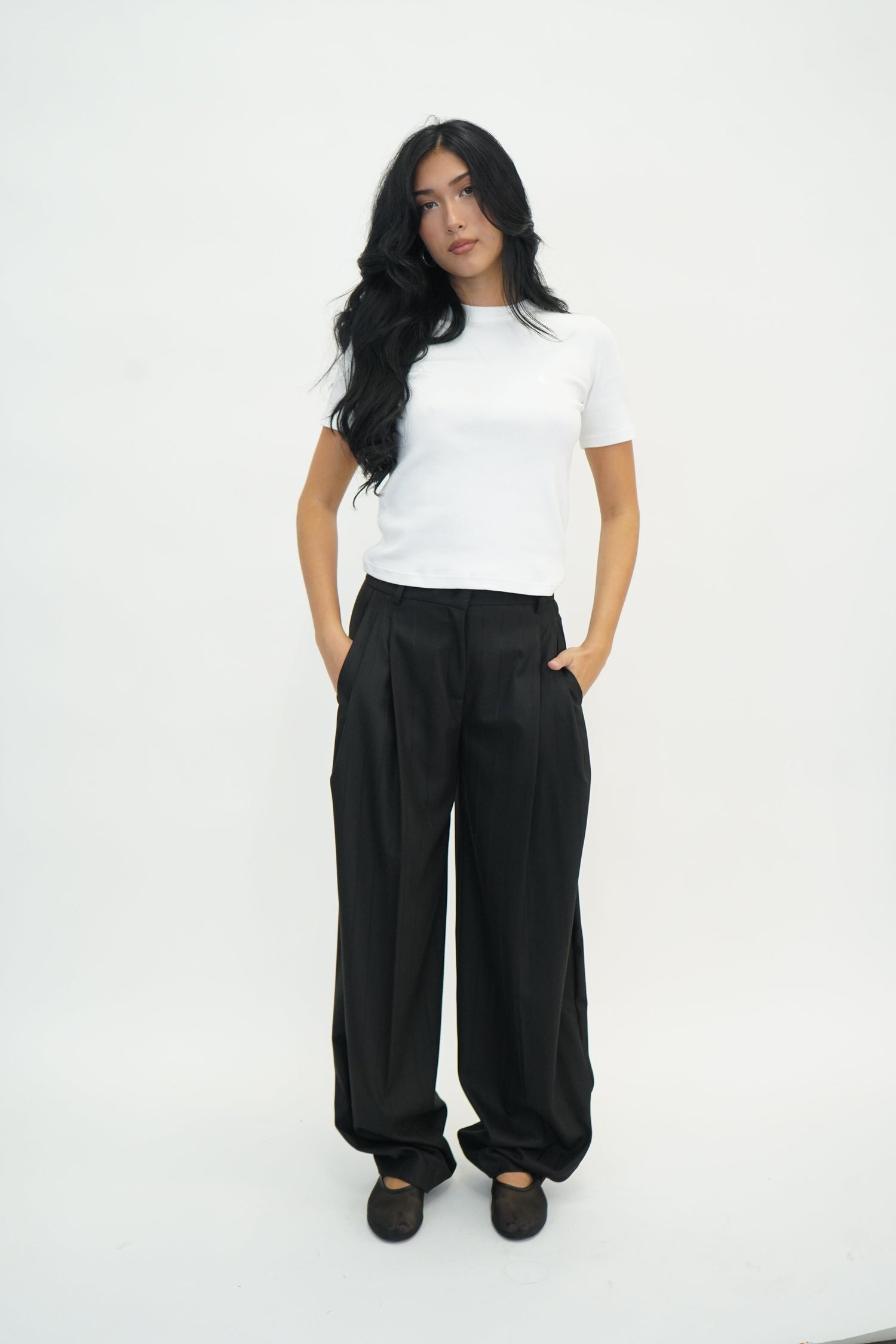 TRACY PINSTRIPED PANTS IN BLACK PANTS THE ANDAMANE 