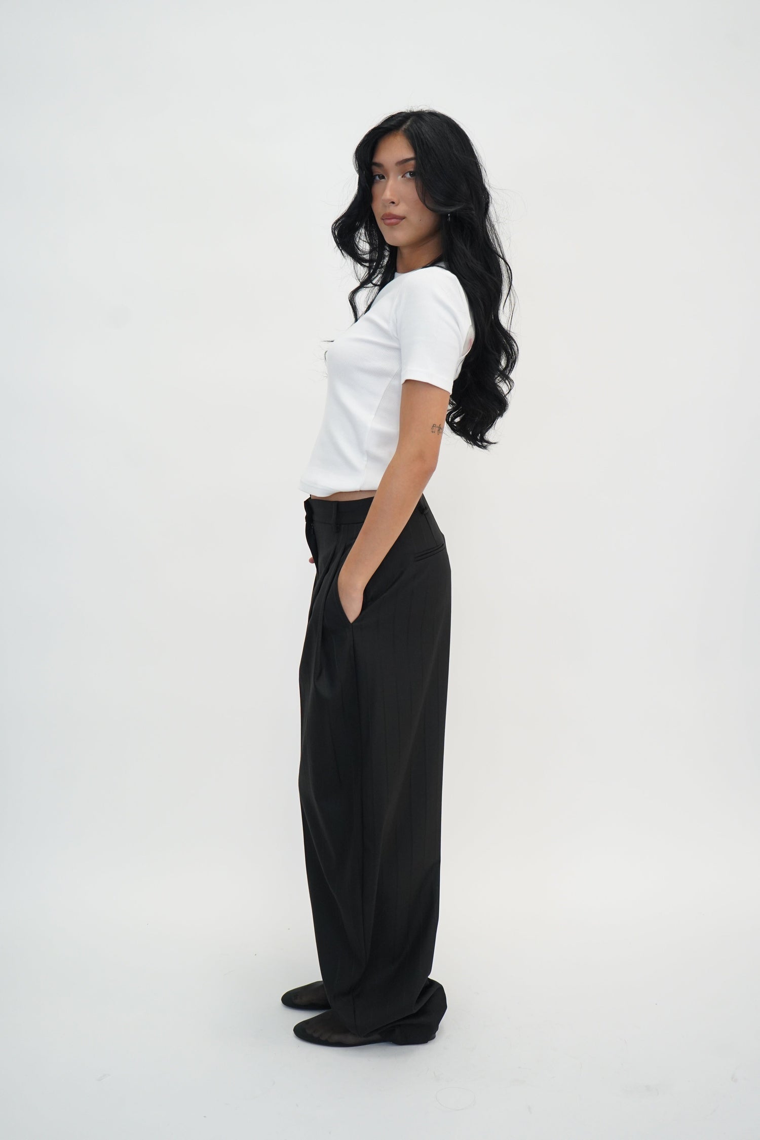TRACY PINSTRIPED PANTS IN BLACK PANTS THE ANDAMANE 