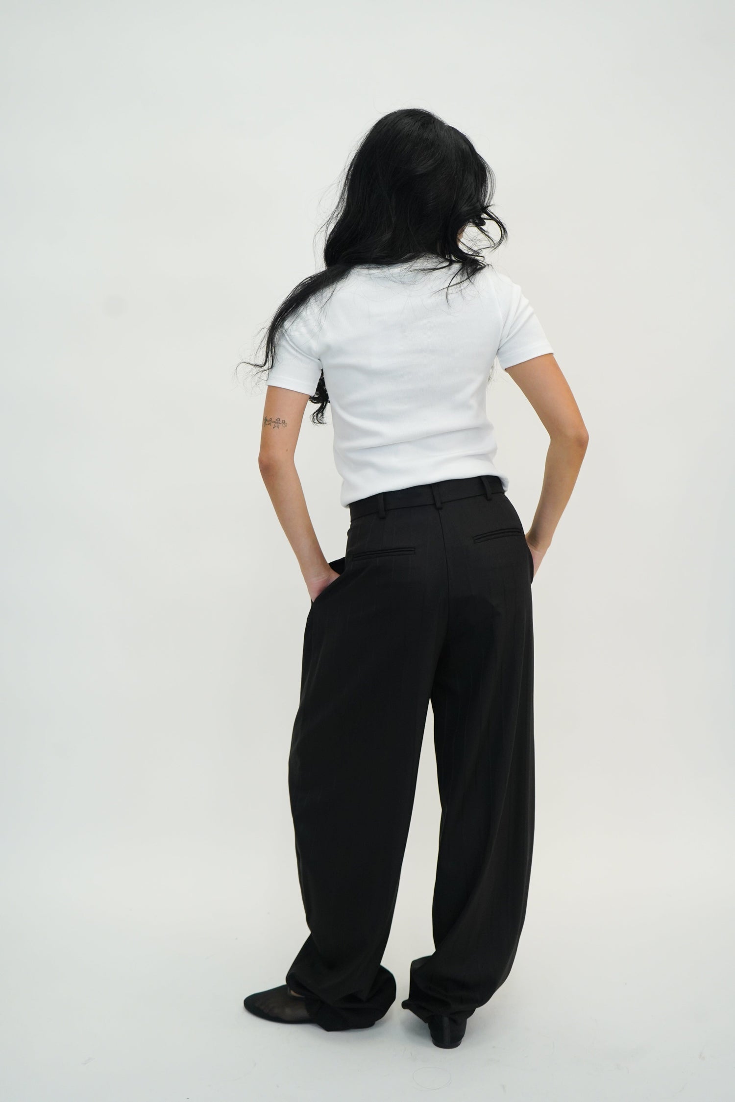 TRACY PINSTRIPED PANTS IN BLACK PANTS THE ANDAMANE 