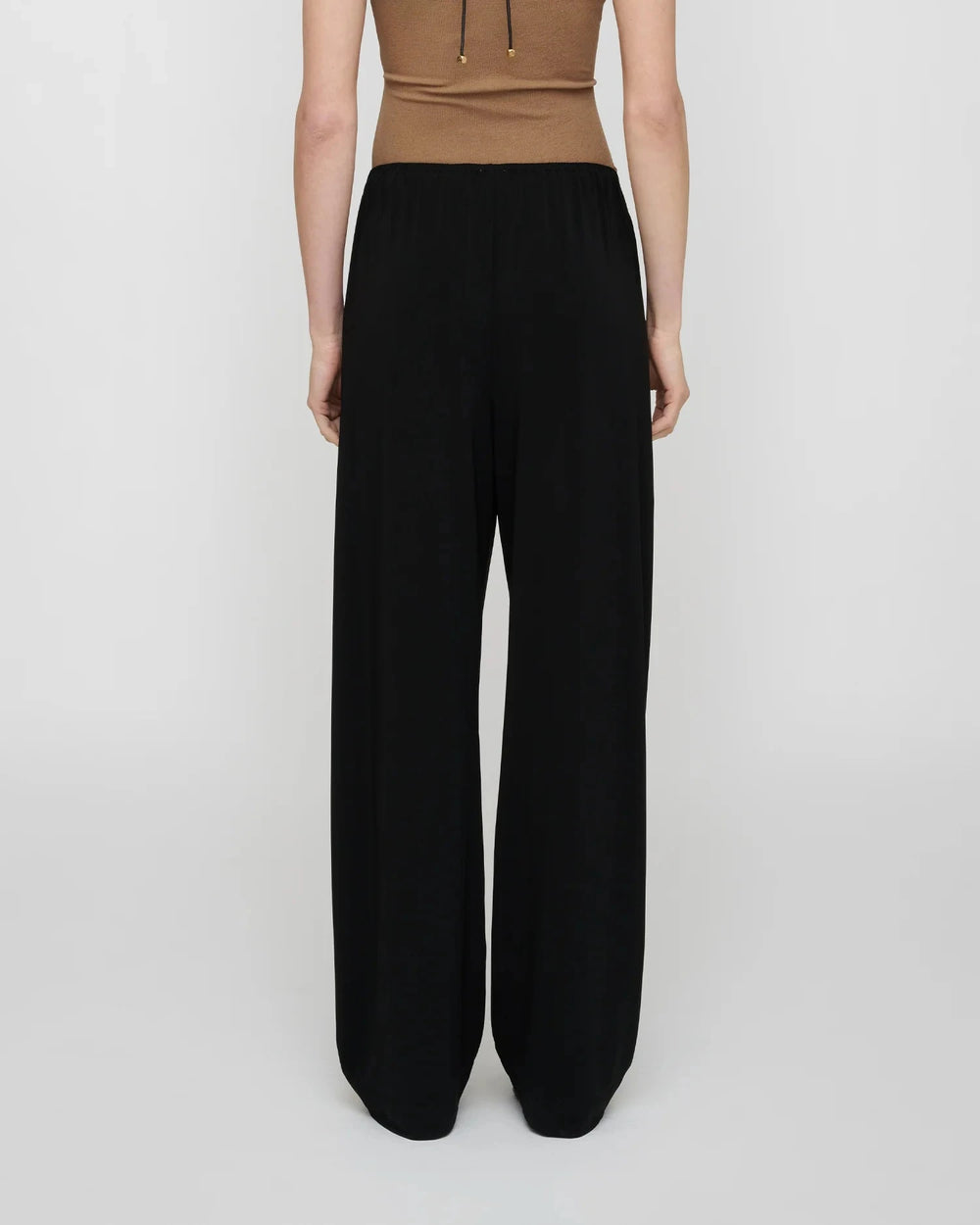 ZOELA FLUID JERSEY PANTS IN BLACK PANTS NANUSHKA 
