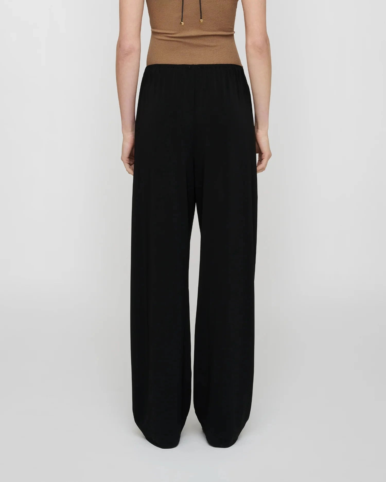 ZOELA FLUID JERSEY PANTS IN BLACK PANTS NANUSHKA 