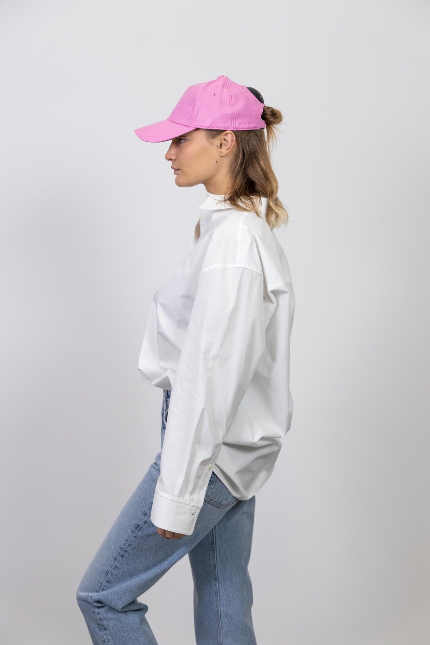 CONNIE FAUX LEATHER CAP IN PINK CAP STAND STUDIO 